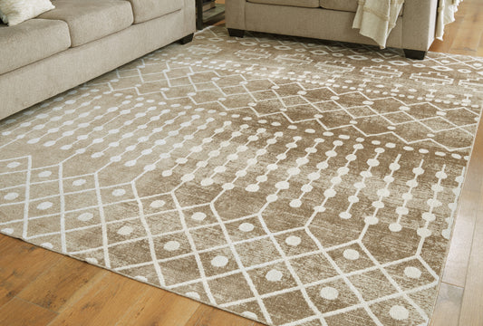 Myers Furniture Outlet - Ashley Furniture - Bunchly Rug - 7'10" x 10'3" Washable Rug / Tan/Brown/Cream - R406221