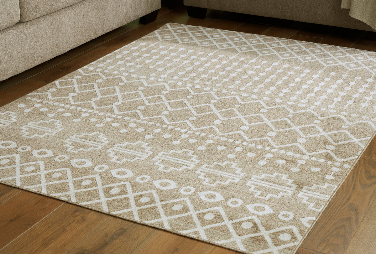 Myers Furniture Outlet - Ashley Furniture - Bunchly Rug - 4'11" x 7'2" Washable Rug / Tan/Brown/Cream - R406222