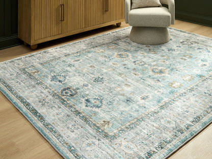Myers Furniture Outlet - Ashley Furniture - Ladstoney Rug - 7'6" x 9'6" Area Rug / Teal/Beige/Ochre - R407501