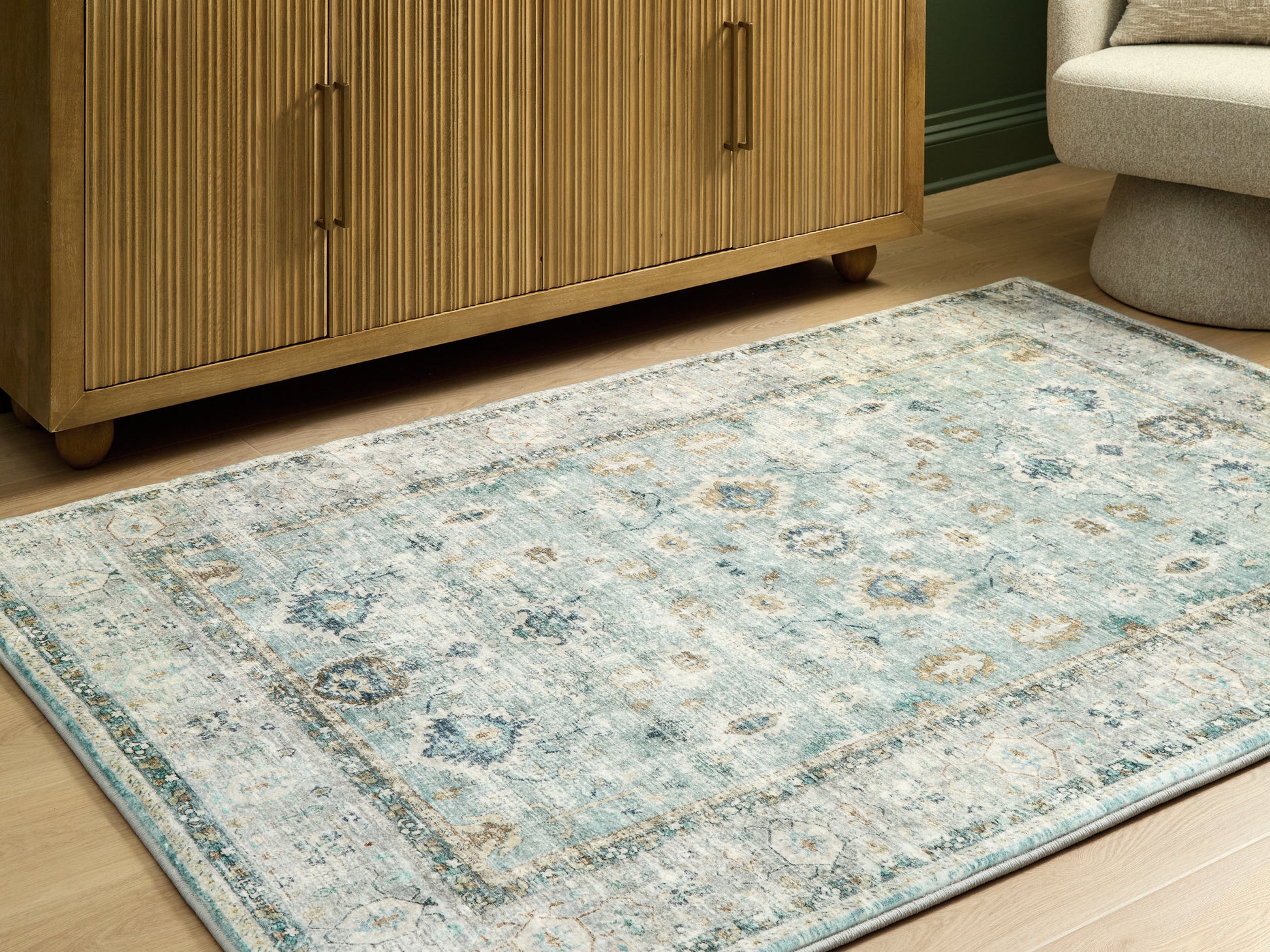 Myers Furniture Outlet - Ashley Furniture - Ladstoney Rug - 7'6" x 9'6" Area Rug / Teal/Beige/Ochre - R407501